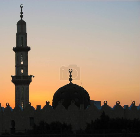 Photo for Hurghada, Egypt July 9, 2007: Mosque in the rays of a pink sunset in Egypt - Royalty Free Image