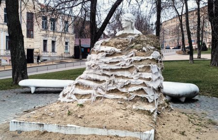 Kyiv, Ukraine March 15, 2024: The monument to Dante Alighieri is protected from explosions in Kyiv
