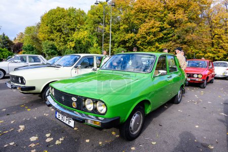 Photo for Bucharest, Romania, 24 October 2021: Old vivid green Romanian Dacia 1310 TX classic car produced in year 1987 parked in a street in the city center, in a sunny autumn day - Royalty Free Image