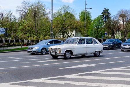 Photo for Bucharest, Romania, 24 April 2021 Old retro white French Renault 16 TL classic car parked in a street in a sunny spring day - Royalty Free Image