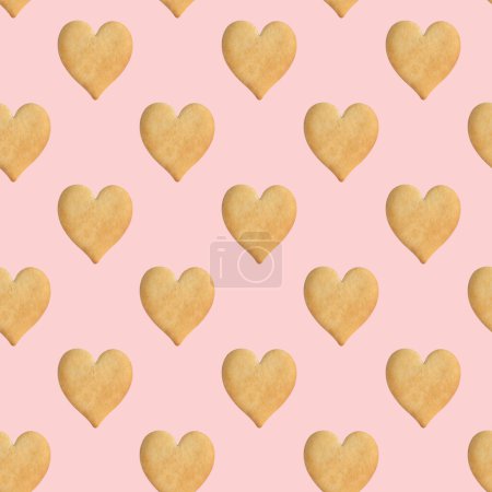Téléchargez les photos : Modèle sans couture de biscuits en forme de cœur sur un fond rose délicat. Saint-Valentin. Fond de cookie. Vue de dessus, plan plat - en image libre de droit
