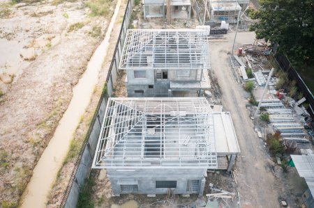 Foto de Home or house under construction in top view consist of floor plan, concrete building, roof steel may called truss, framing or structure. Real estate or property from architecture and engineering. - Imagen libre de derechos