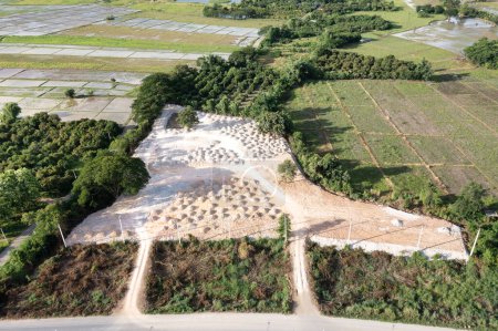 Téléchargez les photos : Land, field and soil backfill in aerial view. Include landscape, empty or vacant area. Real estate or property for plot, subdivision, development, construction, sale or buy in Chiang Mai of Thailand. - en image libre de droit