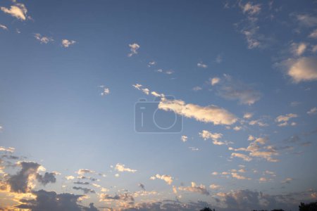 Photo for Beautiful sky and cloud at high. Include space, light of nature, sunset, sunrise. Colorful with yellow, orange and blue color at evening time in autumn for scene, backdrop, background and wallpaper. - Royalty Free Image
