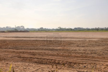 Land, landscape at evening. Include soil backfill, empty or vacant area at outdoor. Real estate or property for small plot, development, housing subdivision, construction and investment in Chiang Mai.