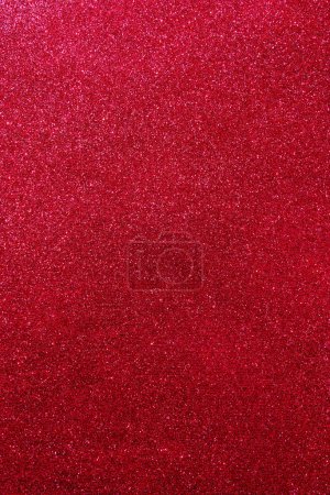 Téléchargez les photos : Background with sparkles. Backdrop with glitter. Shiny textured surface. Vertical image. Dark red. Soft light - en image libre de droit