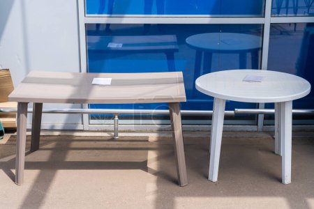 Foto de Plastic table for a personal plot. Weatherproof furniture - Imagen libre de derechos