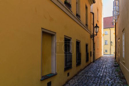 Photo for Narrow city street of European tourist cozy city. Background with selective focus and copy space for text. - Royalty Free Image