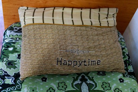 Photo for July 4, 2021, Soroca Moldova pillow in the hostel with the inscription HAPPYTIME. For editorial use. Background - Royalty Free Image