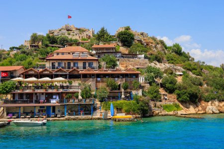 Foto de Rocky Turkish coast, a popular tourist route to the island of Kekova. August 10, 2022 Demre Turkey. - Imagen libre de derechos