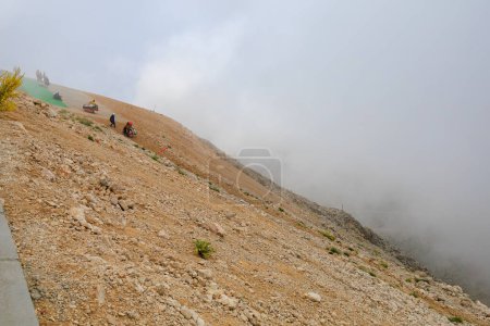 Photo for Thrill-seekers on the top of Mount Tahtali. Illustrative editorial. August 9, 2022 mountain near Kemer, Antalya province, Turkey - Royalty Free Image