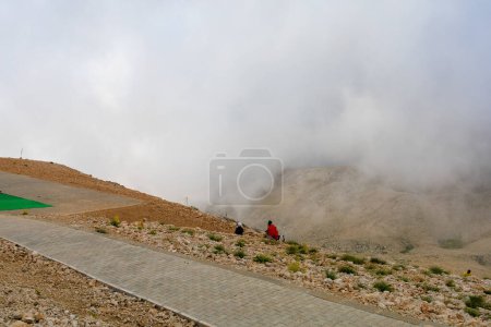 Photo for Thrill-seekers on the top of Mount Tahtali. Illustrative editorial. August 9, 2022 mountain near Kemer, Antalya province, Turkey - Royalty Free Image