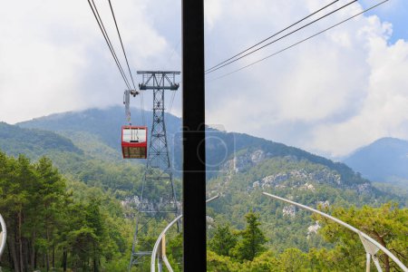 Photo for Cabin of the cable car lift to Mount Tahtali in the Western Taurus mountain system. Illustrative editorial. August 9, 2022 mountain near Kemer, Antalya province, Turkey - Royalty Free Image