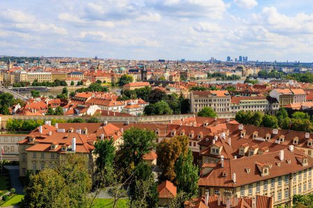 Photo for Roofs of houses and a view of the city of Prague. Background with selective focus and copy space for text - Royalty Free Image