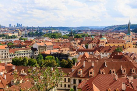 Photo for Roofs of houses and a view of the city of Prague. Background with selective focus and copy space for text - Royalty Free Image