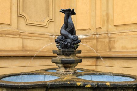 Photo for Ancient fountains with sculptures in the architecture of the city. Historical and cultural heritage Background with selective focus and copy space - Royalty Free Image