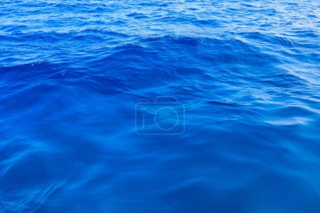 Photo for Very nice sea water background or backdrop with selective focus. Small waves of natural water surface texture. Still calm ripples colorful blue wave in a river or ocean. - Royalty Free Image