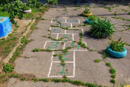 Photo for Backyard markings for hopscotch. Background with selective focus and copy space - Royalty Free Image