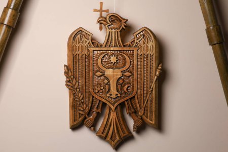 Photo for December 5, 2023 Balti Moldova. The state emblem of the Republic of Moldova carved from wood. An unusual hobby. For editorial use - Royalty Free Image
