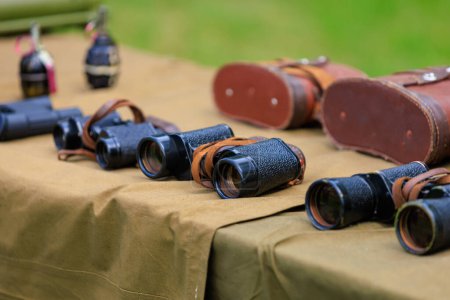 Binoculars in the military headquarters. Background with selective focus and copy space for text