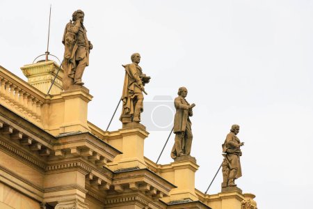 Photo for Ancient sculptures in the architecture of the city. Historical and cultural heritage. Background with selective focus and copy space - Royalty Free Image