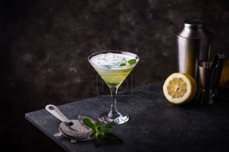 Photo for Cocktail or mocktail with lemon and mint on black background - Royalty Free Image