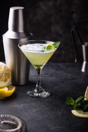Photo for Cocktail or mocktail with lemon and mint on black background - Royalty Free Image