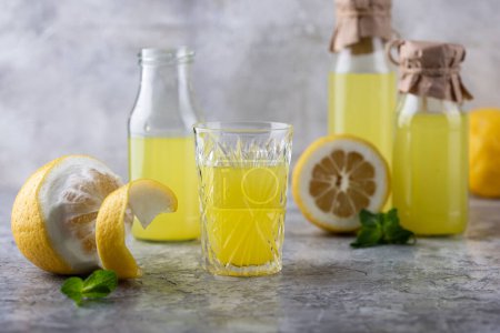 Photo for Traditional italian limoncello or lemon liquor or homemade lemonade - Royalty Free Image