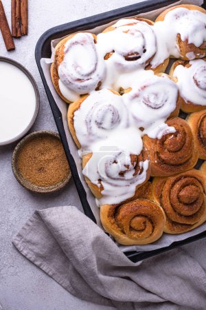 Photo for Traditional sweet cinnamon rolls or cinnabon with icing - Royalty Free Image