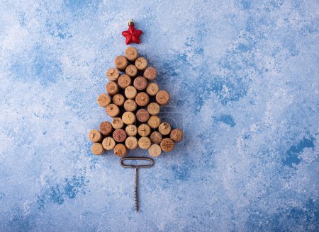 Photo for Christmas tree made from wine bottle corks with red decoration - Royalty Free Image