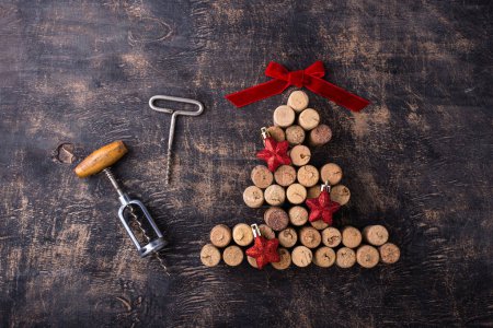 Photo for Christmas tree made from wine bottle corks with red decoration - Royalty Free Image