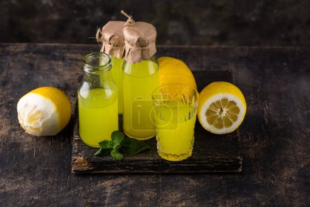Photo for Traditional italian limoncello or lemon liquor or homemade lemonade - Royalty Free Image