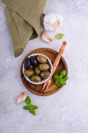 Photo for Bowl with Greek green and black spicy pickled olives - Royalty Free Image