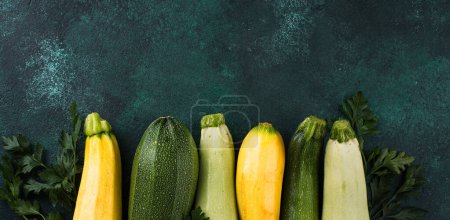 Photo for Assortment of different color of fresh zucchini on table, banner for site - Royalty Free Image