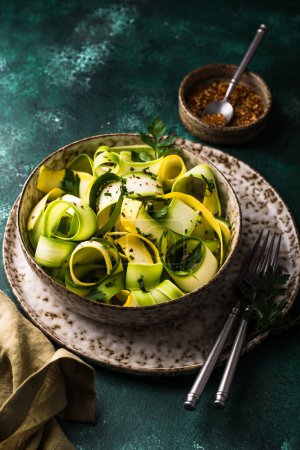 Photo for Raw sliced zucchini vegan pasta or salad. Healthy food - Royalty Free Image