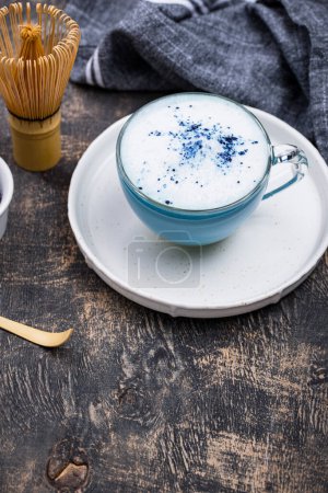 Blue matcha latte with milk. Trendy drink from Butterfly pea