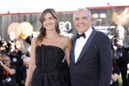 Photo for VENICE, ITALY - AUGUST 30: Giulia Rosmarini and Director of the Festival Alberto Barbera attend the opening red carpet at the 80th Venice International Film Festival on August 30, 2023 in Venice, Italy. - Royalty Free Image