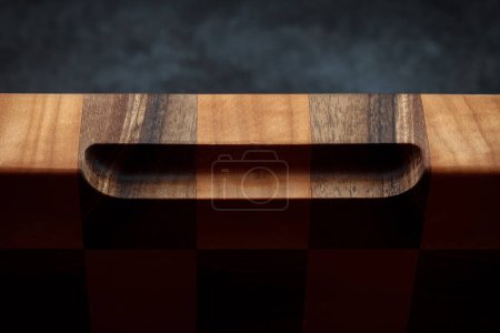 Photo for Vintage cutting board. Accessories for cooking at home. Board for cutting products. Cutting board for steaks. Product from different types of wood. - Royalty Free Image