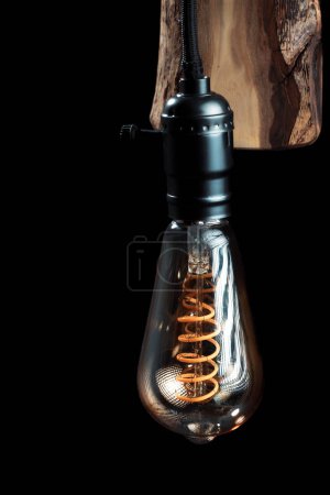 Photo for Vintage wall lamp to illuminate the terrace. Antique lamp with Edison bulb. The concept of saving energy or lack of ideas. Turned off lamp on a dark background. - Royalty Free Image