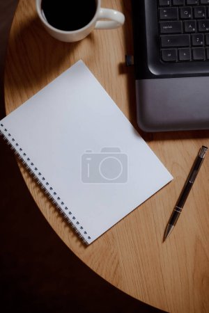 Photo for Writer's high: laptop, blank page and aromatic coffee. Coffee creative: ideas on a blank sheet with a coffee drink. Business in every shade: professional elegance in every frame. - Royalty Free Image