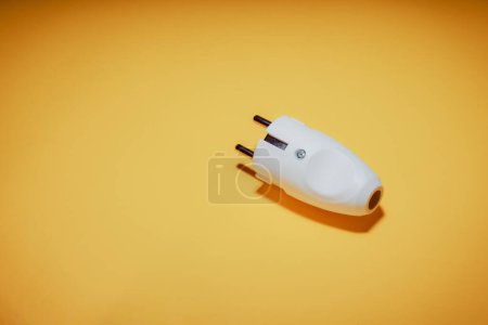 Photo for Electrical plug with European standard socket. The concept of electrical equipment. Concept of a day without electricity. Eco-friendly fuels. Yellow background. - Royalty Free Image