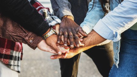 Photo for Diversity and teamwork as a group of diverse people joining hands as a multiracial society and multicultural community - joined and united team building as a together and togetherness concept. - Royalty Free Image