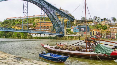 Photo for Typical flat-bottom boats, Rabelos and Luis I Bridge, Dom Luis Bridge, Douro River, Old City, World Heritage Site, Oporto, Porto, Portugal, Europe - Royalty Free Image