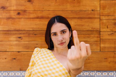 Photo for Close-up horizontal portrait of a beauty and rude woman showing the index finger to the camera - Royalty Free Image
