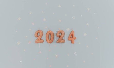 Photo for Shiny light brown candles number 2024 lie with white shiny festive confetti lie in the center on a pastel blue background with copy space on the sides, flat lay close-up. - Royalty Free Image