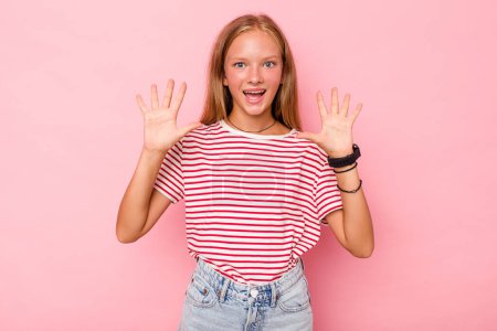 Photo for Caucasian teen girl isolated on pink background receiving a pleasant surprise, excited and raising hands. - Royalty Free Image