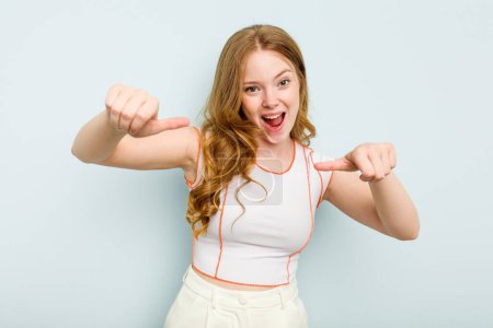 Photo for Young caucasian woman isolated on blue background raising both thumbs up, smiling and confident. - Royalty Free Image