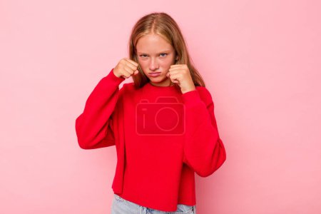 Photo for Caucasian teen girl isolated on pink background throwing a punch, anger, fighting due to an argument, boxing. - Royalty Free Image
