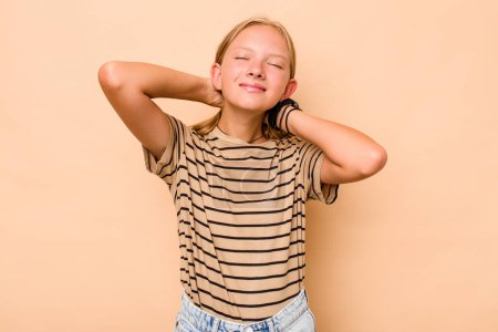 Photo for Caucasian teen girl isolated on beige background feeling confident, with hands behind the head. - Royalty Free Image