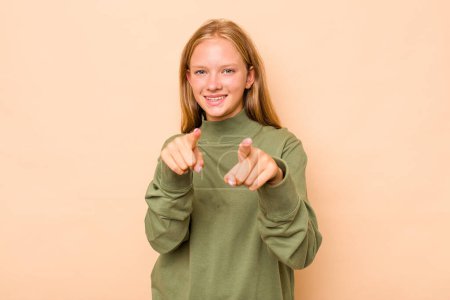 Photo for Caucasian teen girl isolated on beige background pointing to front with fingers. - Royalty Free Image